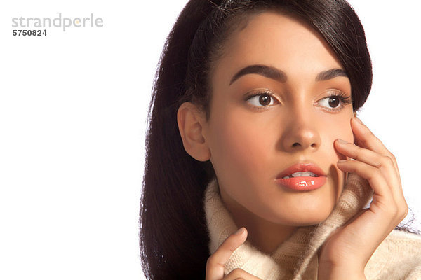 Young Woman looking away in Rollkragen against white background