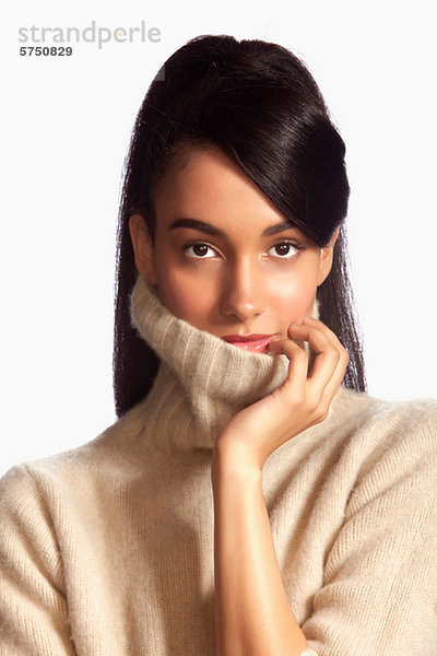 Young Woman wearing Rollkragen against white background