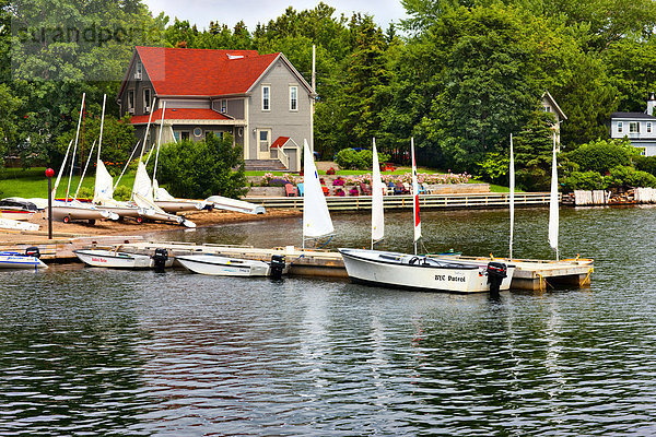 Sailboats on Baddeck waterfront  Cape Breton  Nova Scotia Canada