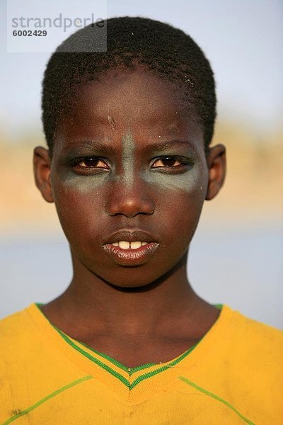 Junge mit Make-up  St. Louis  Senegal  Westafrika  Afrika