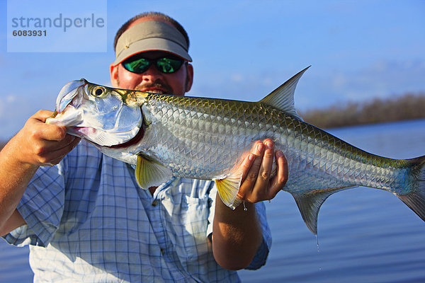 fangen  klein  groß  großes  großer  große  großen  Bahamas  Fischer  Inagua  Stange