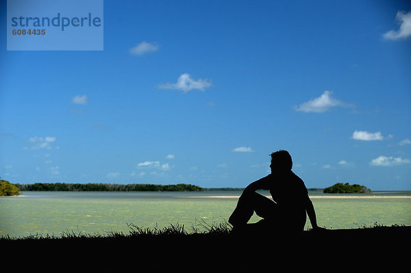 Mann  sitzend  Silhouette  Küste  Florida