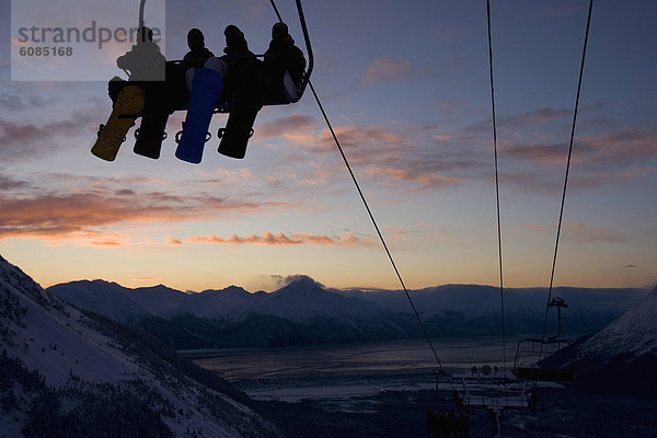 Snowboardfahrer  4  Sonnenuntergang  heben  Silhouette  Ski  Ar