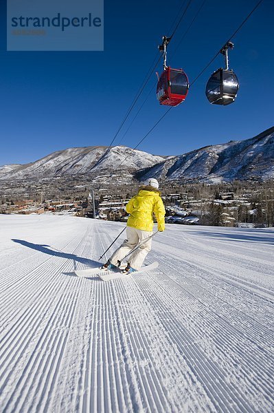 Woman skiing in Aspen  Colorado.