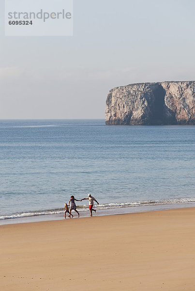 Portugal  Family running on beach