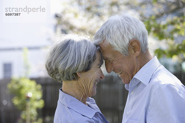 Germany  Bavaria  Senior couple looking at each other  smiling
