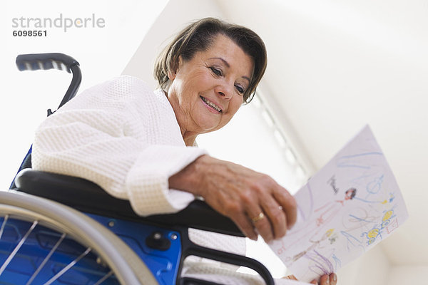 Senior woman sitting on wheelchair