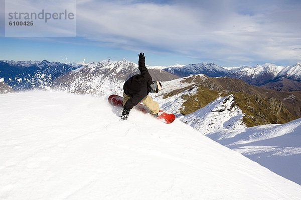 Snowboarding  Snowboardfahrer  drehen  Seitenansicht  Neuseeland  Queenstown
