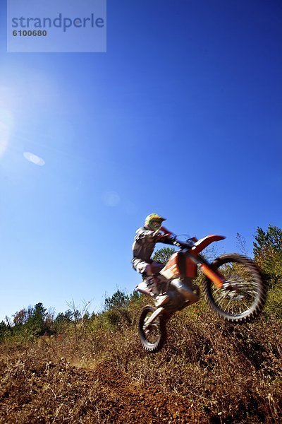 Gegenlicht  fangen  springen  Himmel  Bewegungsunschärfe  Motorradfahrer  Alabama  Blendenfleck  lens flare