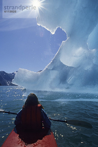Kayaker in front of glacier  Alaska.