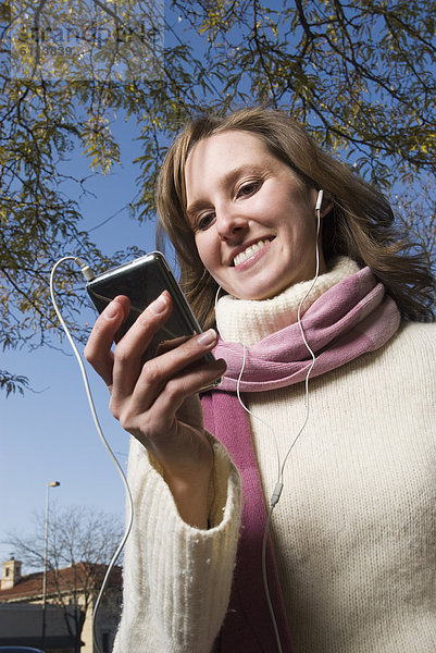 Frau  zuhören  Festung  MP3-Player  MP3 Spieler  MP3 Player  MP3-Spieler  Colorado  Innenstadt  Ipod