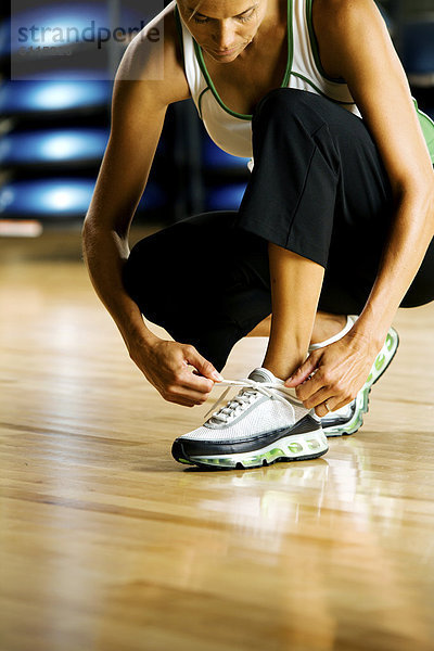 Fitness-Studio  Frau  üben