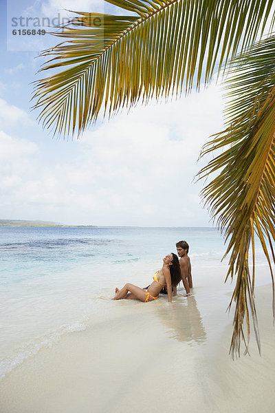 sitzend  Strand  Südamerika