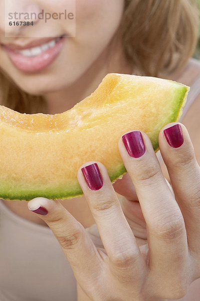 Frau  Hispanier  Scheibe  Melone  essen  essend  isst