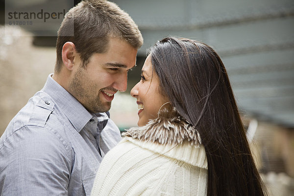 Couple smiling at each other