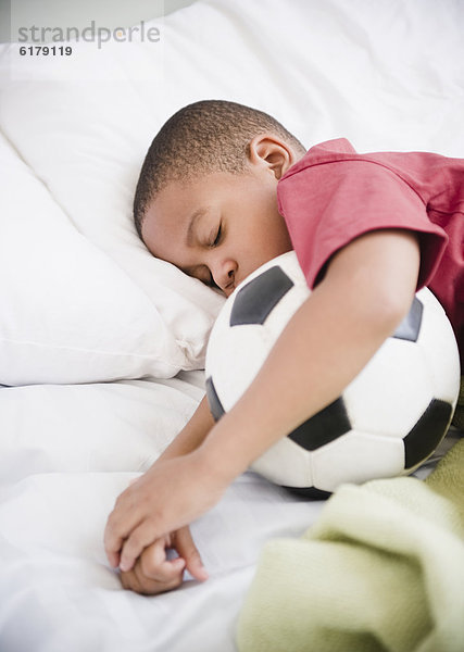 Junge - Person schlafen amerikanisch Fußball Ball Spielzeug