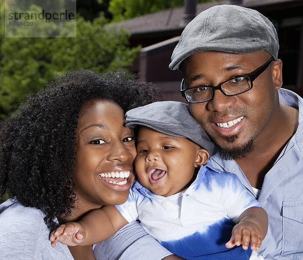 African American mother  father and baby son