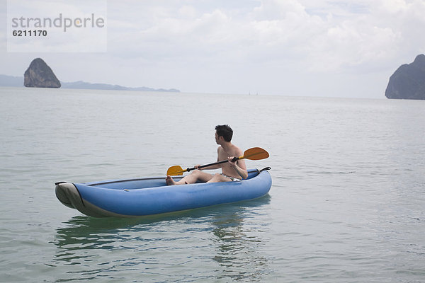 Mann  Ozean  Boot  chinesisch  paddeln