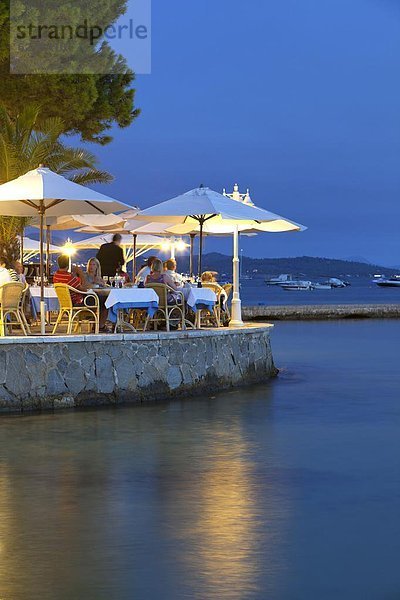 Waterfront restaurant in the evening  Port de Pollenca (Puerto Pollensa)  Mallorca (Majorca)  Balearic Islands  Spain  Mediterranean  Europe