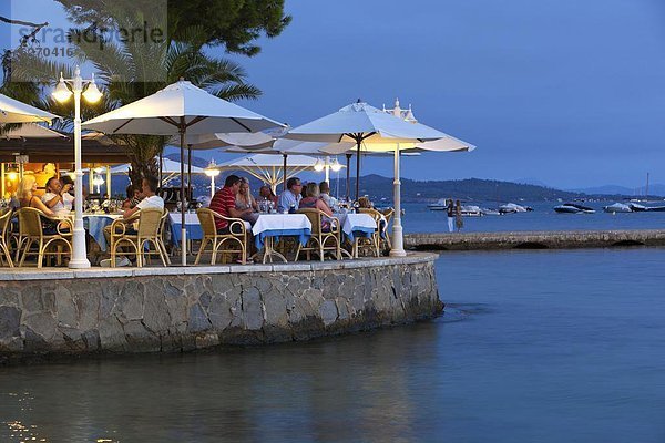 Waterfront restaurant in the evening  Port de Pollenca (Puerto Pollensa)  Mallorca (Majorca)  Balearic Islands  Spain  Mediterranean  Europe