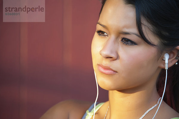 USA  Texas  Teenage girl with head phones  close up