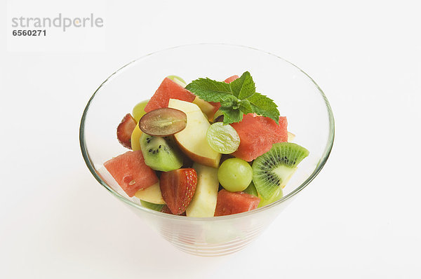 Bowl of fruit salad on white background