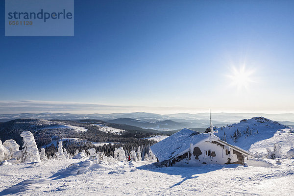Germany  Bavaria  View of snow covered mountain hut at Bavarian Forest