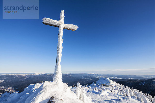 Germany  Bavaria  View of summit cross on mountain at Bavarian Forest