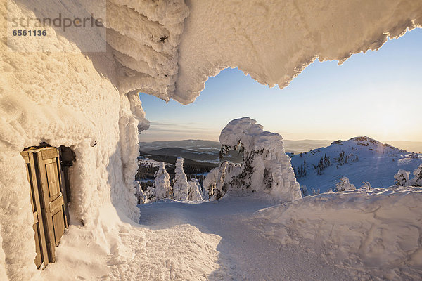 Germany  Bavaria  View of snow covered mountain hut at Bavarian Forest