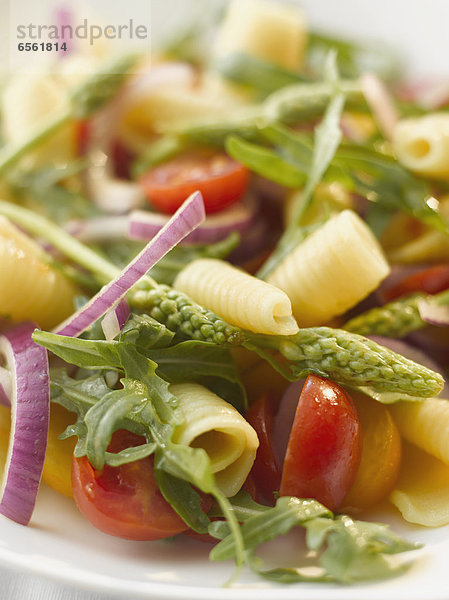 Plate of pasta salad with campanelle and wild asparagus  close up