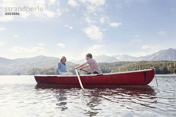 Germany  Bavaria  Couple in rowing boat  smiling