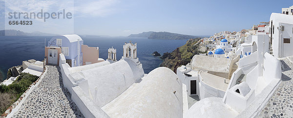 Greece  View of Oia village with cobbled path and bell tower at Santorini