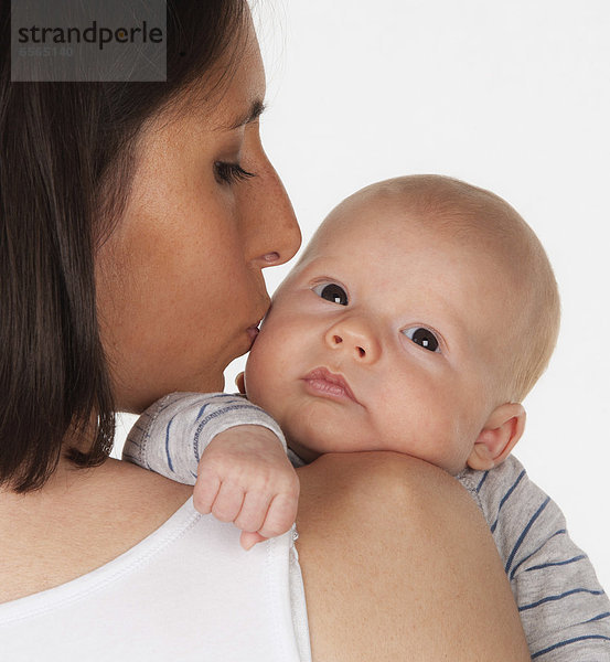 Mother kissing baby boy  close up