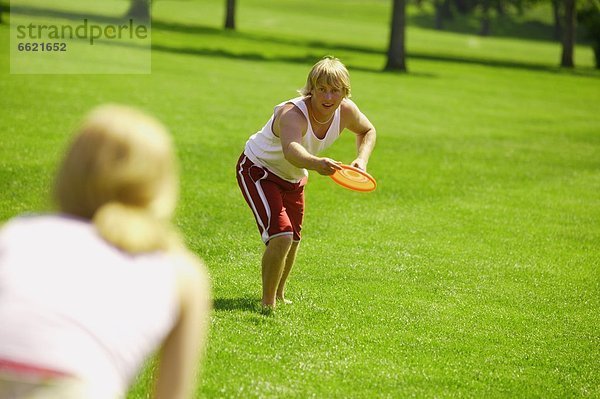 Tossing Frisbee