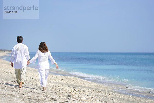 Couple walking on beach