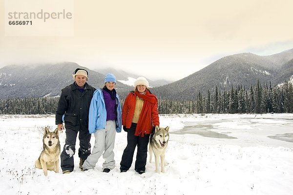 Australian Tourists In British Columbia  Canada  Standing Next To Wolves