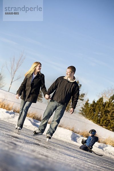 Couple Skating With Child