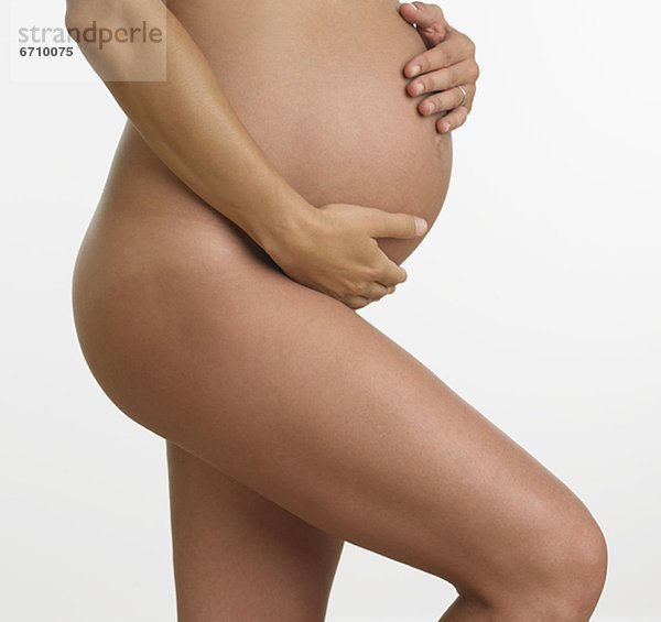 Frau  halten  Schwangerschaft  schießen  Studioaufnahme  nackt