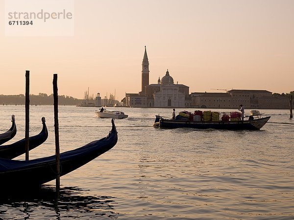 'Gondolas And Boats On Canal  Church Of St. Giorgio Maggiore In Background