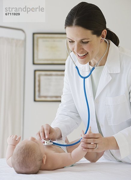 Frau Doktor examining baby