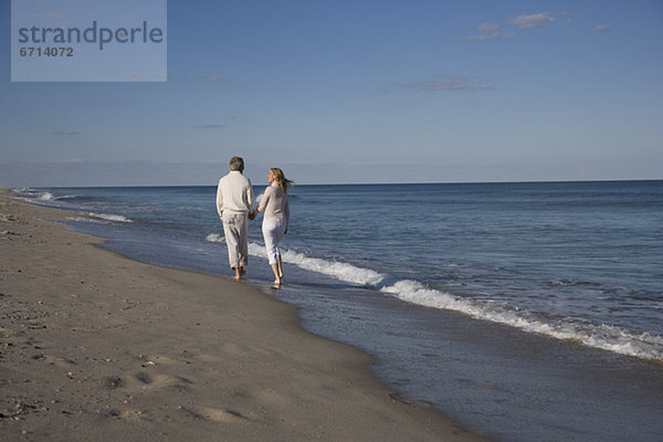 Couple walking on beach