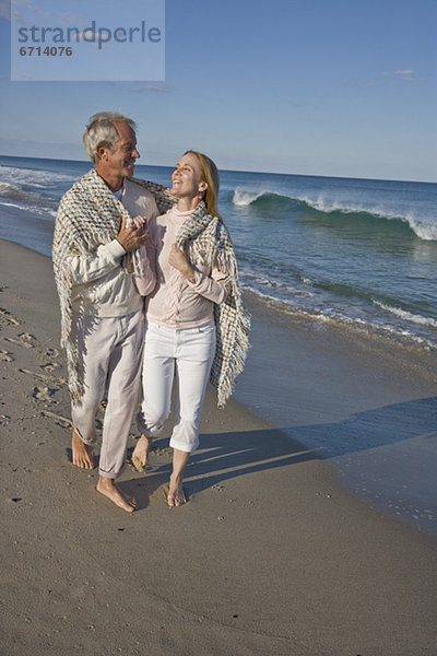 Couple walking on beach