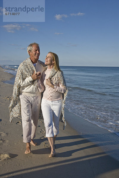 Couple walking on beach