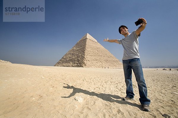 pyramidenförmig  Pyramide  Pyramiden  Mann  Fotografie  nehmen  Hintergrund  Pyramide