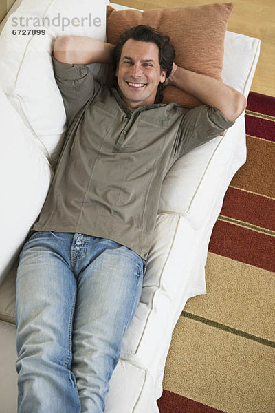 Man relaxing on sofa