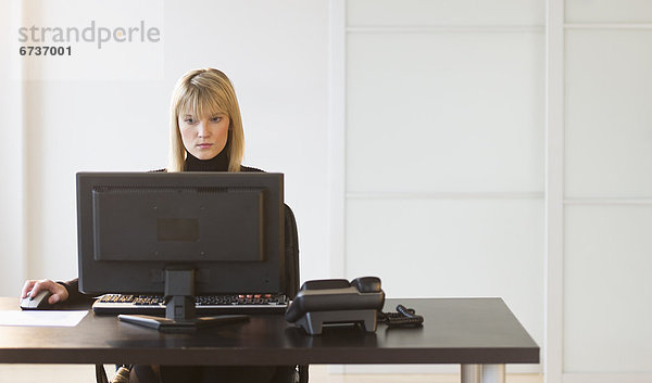 Businesswoman working on computer