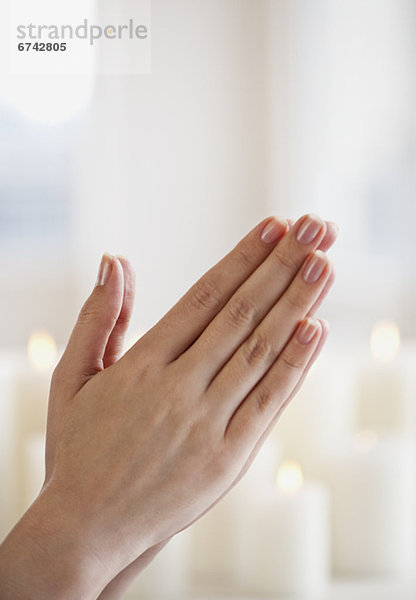 Woman praying  close-up of hands