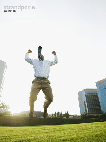 Businessman jumping