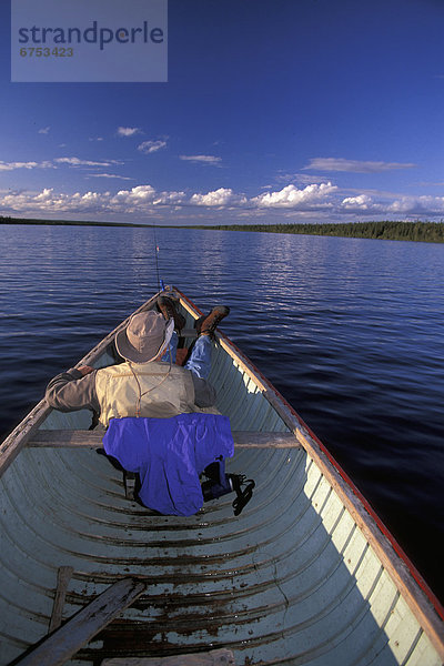 Man Relaxing in Canoe  Sutton Lake  Northern Ontario