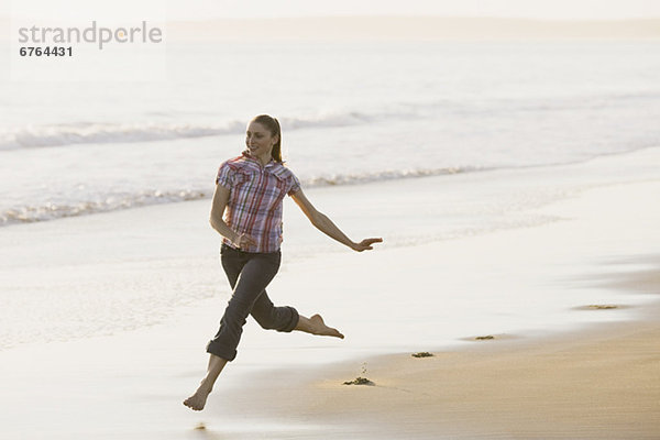 Woman running on beach